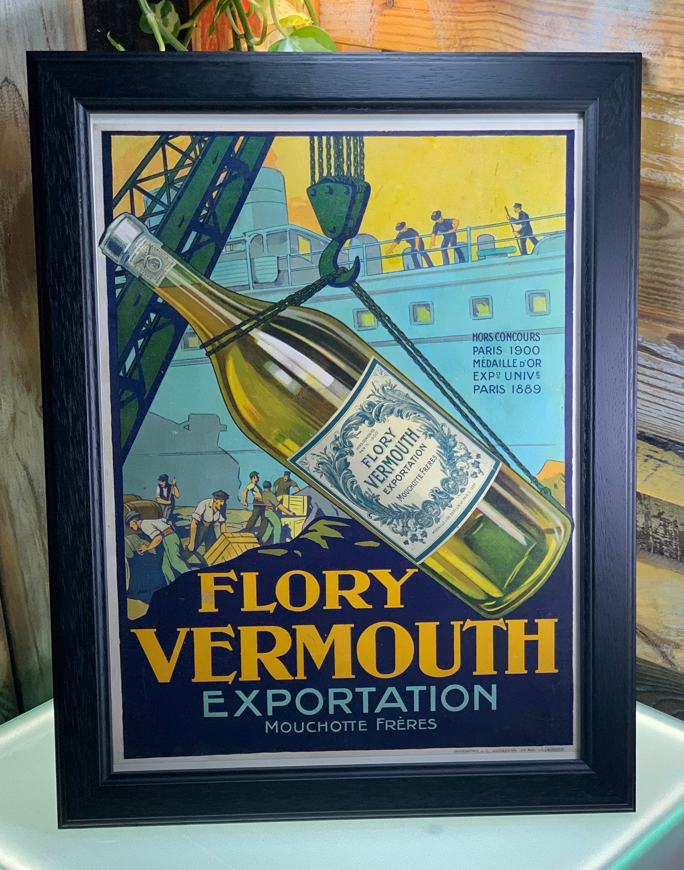 Affiche publicitaire entoilée pour l’apéritif Vermouth Flory. Mouchotte frères.